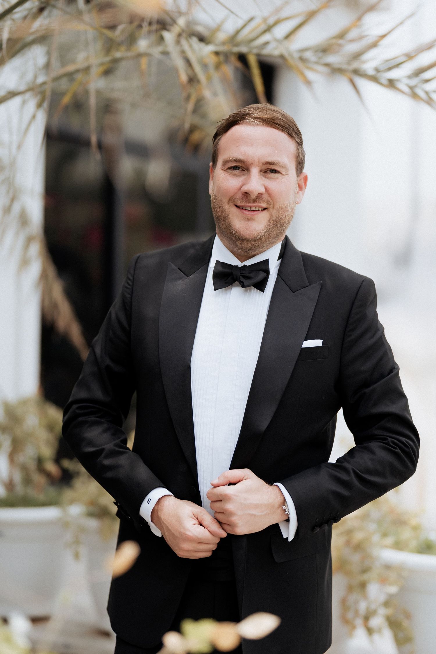 Elegant groom wedding portrait with formal styling