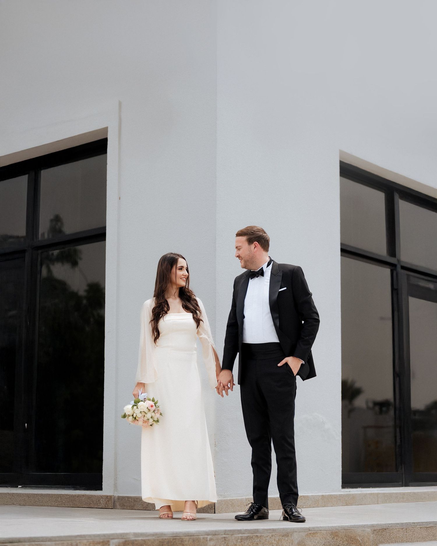 Civil marriage couple photoshoot outside contemporary venue