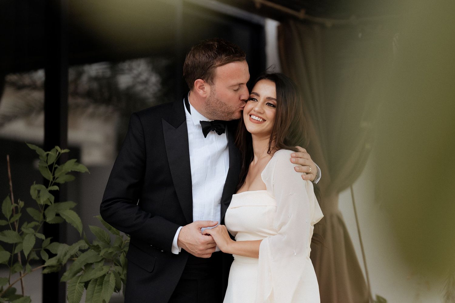 Natural wedding couple photography with soft greenery backdrop