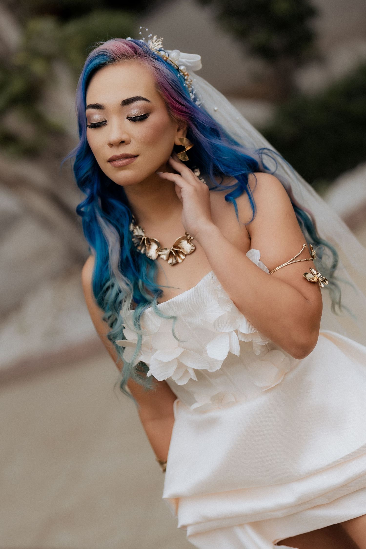 Close up bridal portrait with blue hair and veil during wedding in Dubai