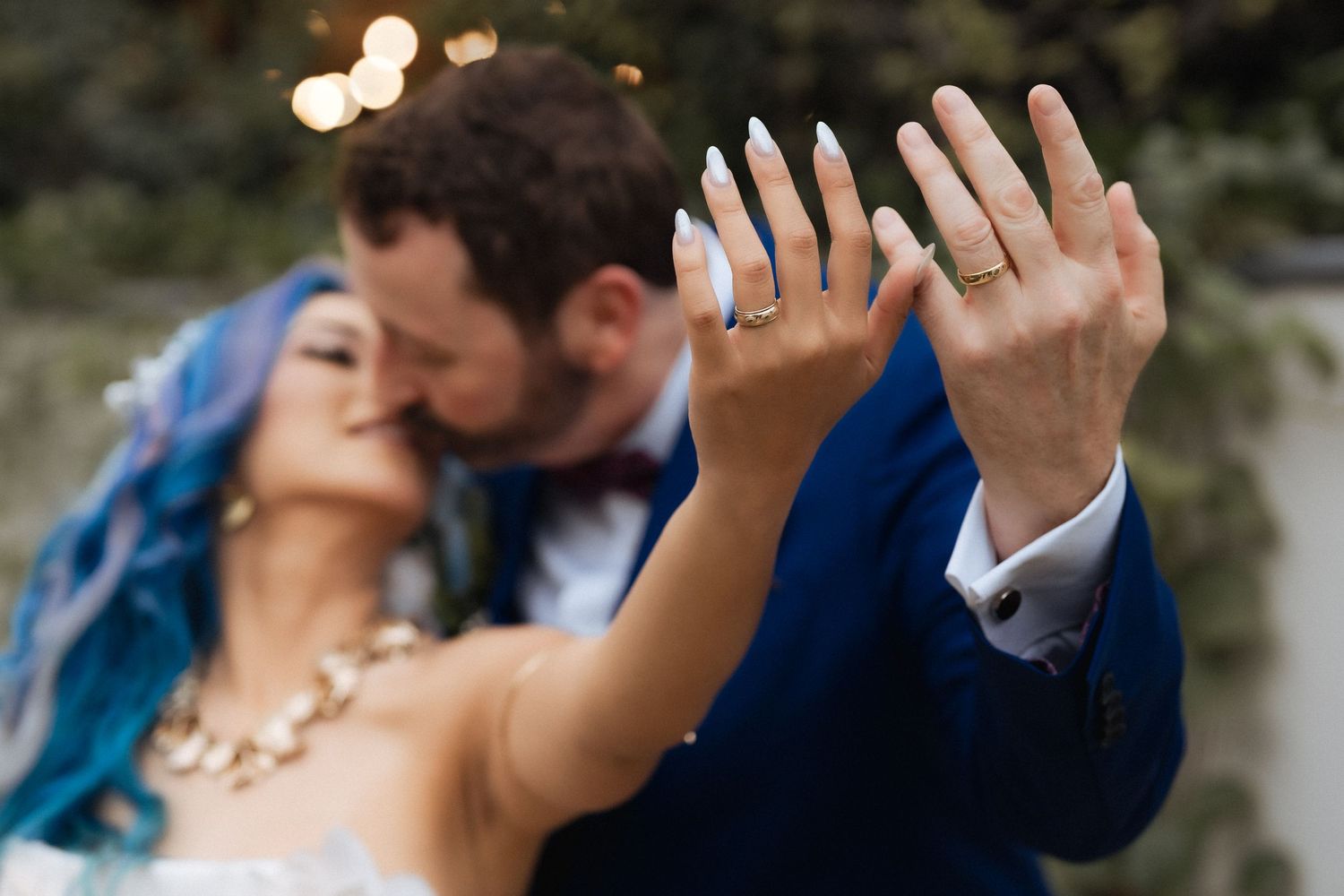 Bride and groom showing wedding rings during romantic wedding portrait in Dubai