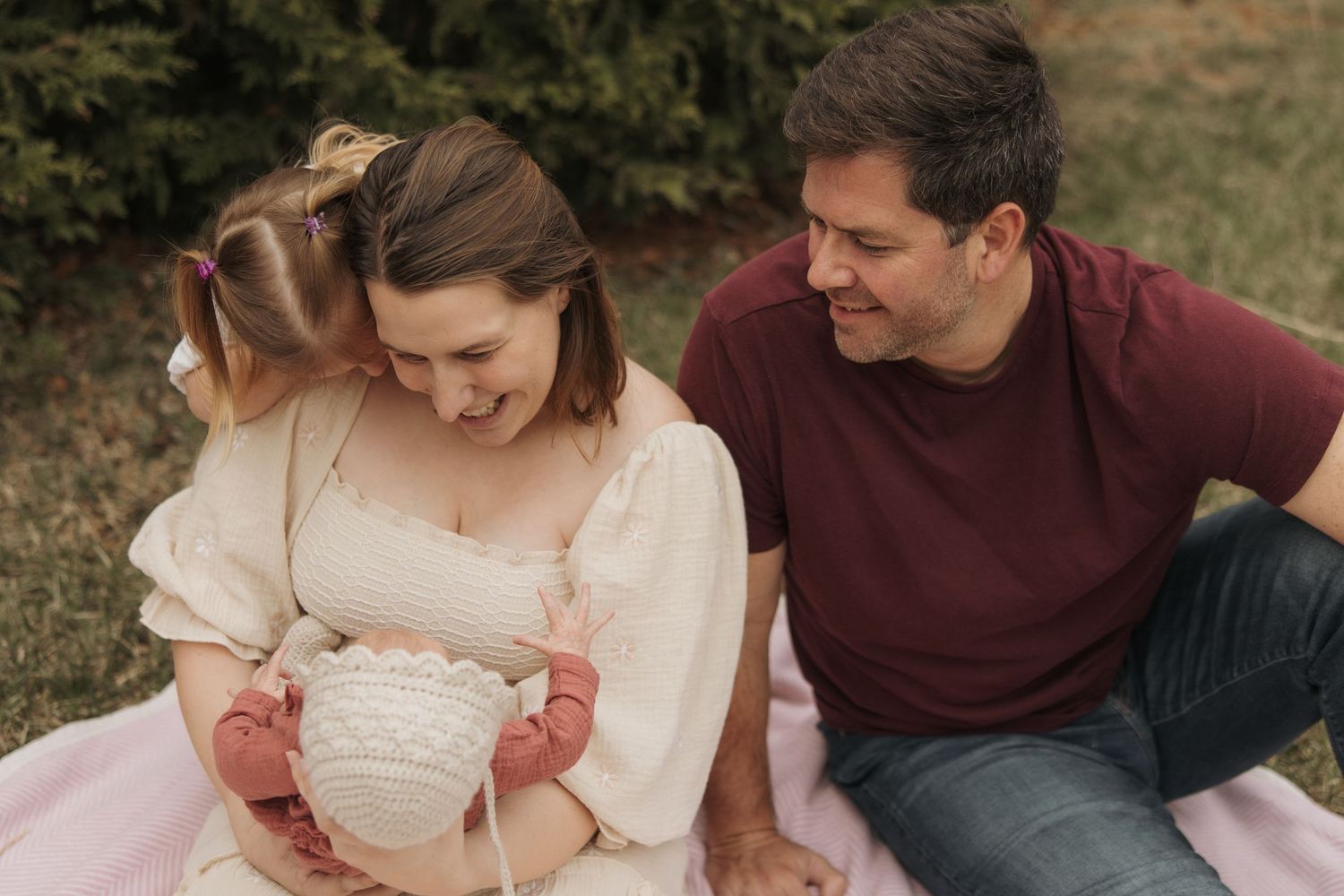 A couple shares an intimate moment outdoors during a romantic fall photo session.