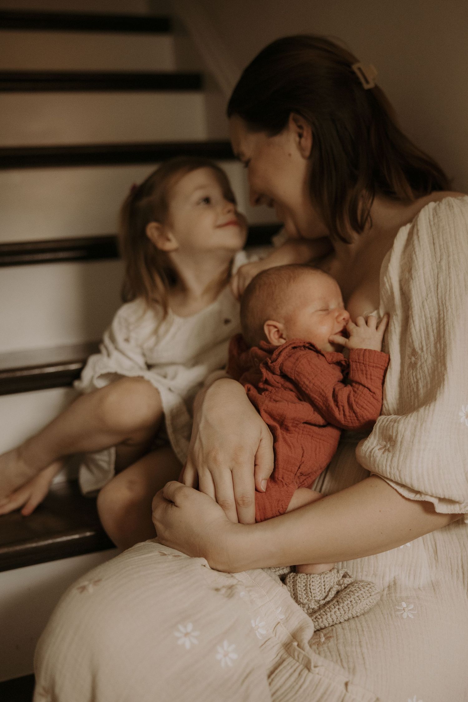 Tender moments captured in a series of intimate photographs showing parent and child bonding in warm natural light.