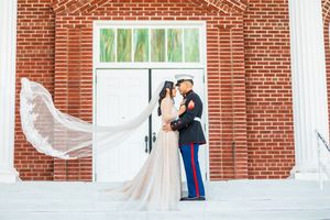 Camp Lejeune Marine Groom kissing his bride in Jacksonville, NC.