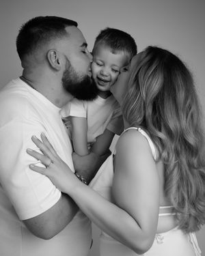 A romantic black and white photo series showing an intimate couple embracing and sharing tender moments together.