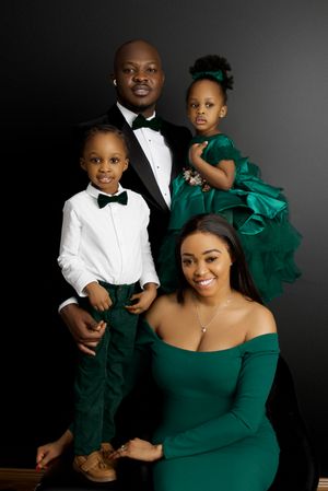 Studio portrait series in emerald green and formal black and white attire showing a family against dark background.