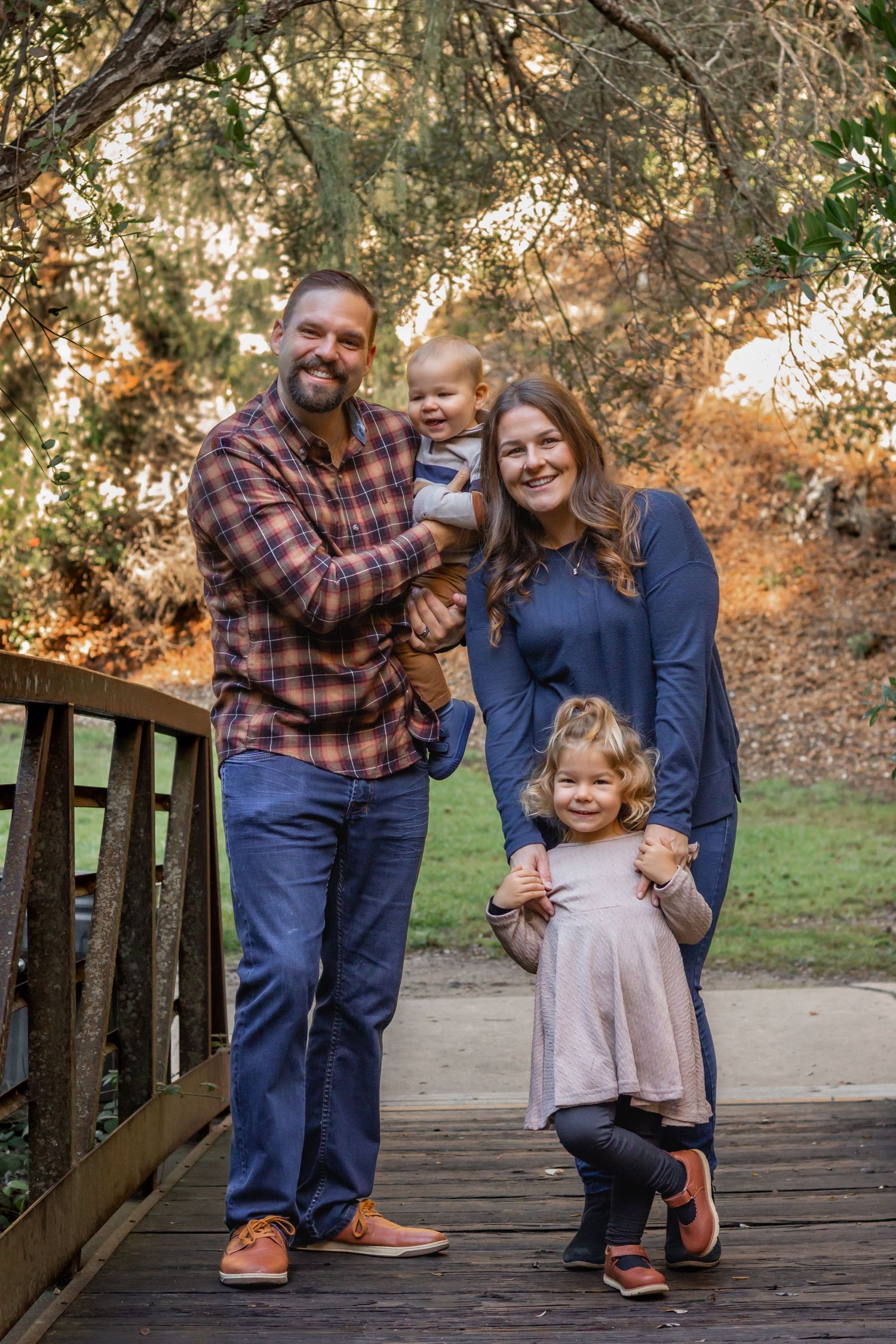 Family portrait session outdoors showing playful moments.. Lompoc, Santa Barbara, and San Luis Obispo County Photographer.