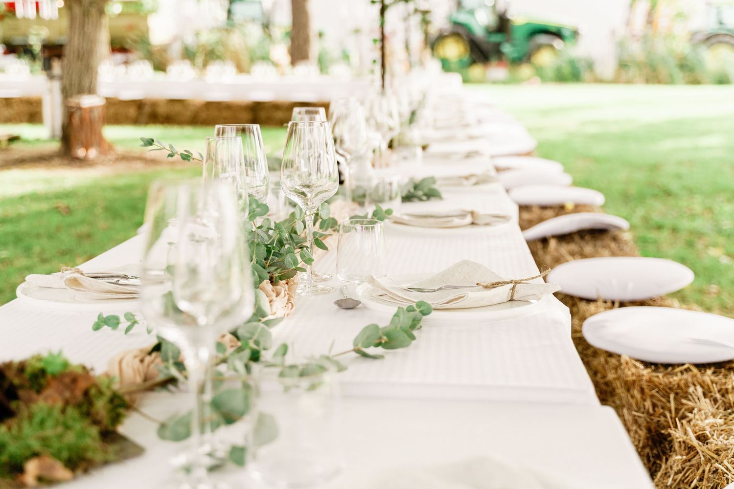 Wedding reception dinner at L’Embucaire restaurant with natural floral décor and rustic elegance.