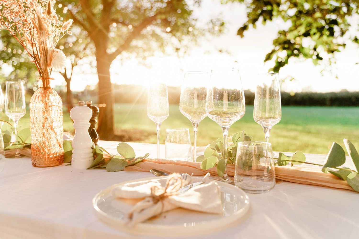 Wedding reception dinner at L’Embucaire restaurant with natural floral décor and rustic elegance.