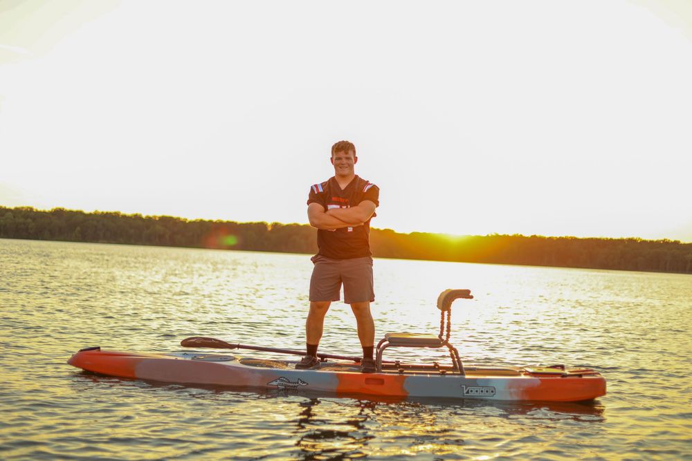 senior photo male lake football