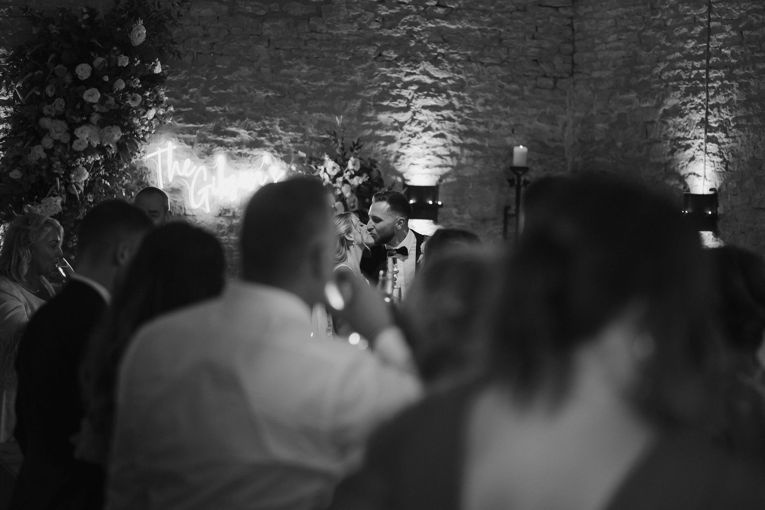 bride and groom kissing at end of wedding speeches at ivy lodge in cirencester