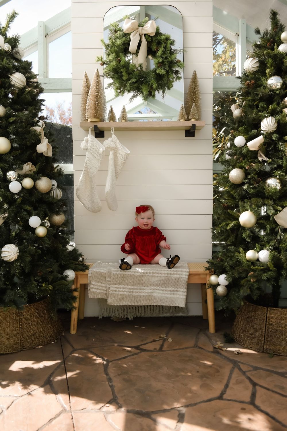 A sequence of Christmas photos showing a decorated evergreen tree with white ornaments against a white shiplap wall.