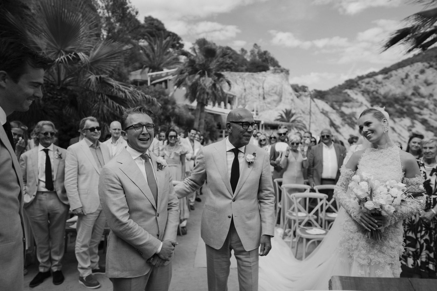 father of bride comforting groom at front of the ceremony at amante ibiza