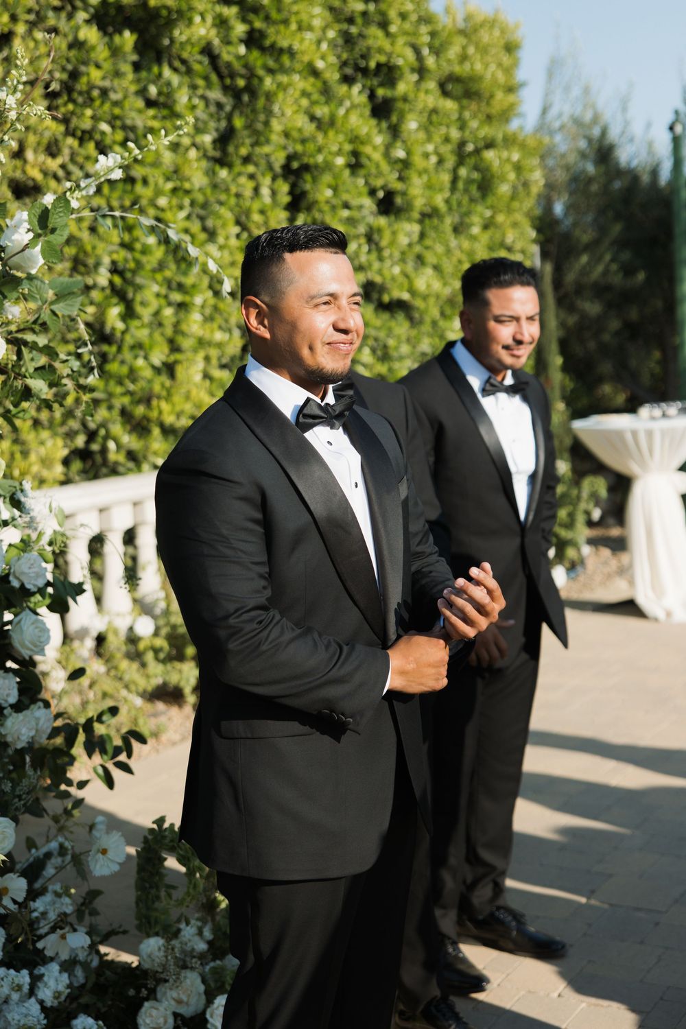 Groom as he watches his bride walk down the aisle at Tuscan Rose Ranch in Santa Paula, California