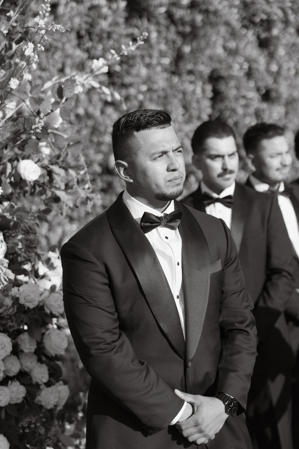 Groom as he watches his bride walk down the aisle at Tuscan Rose Ranch in Santa Paula, California
