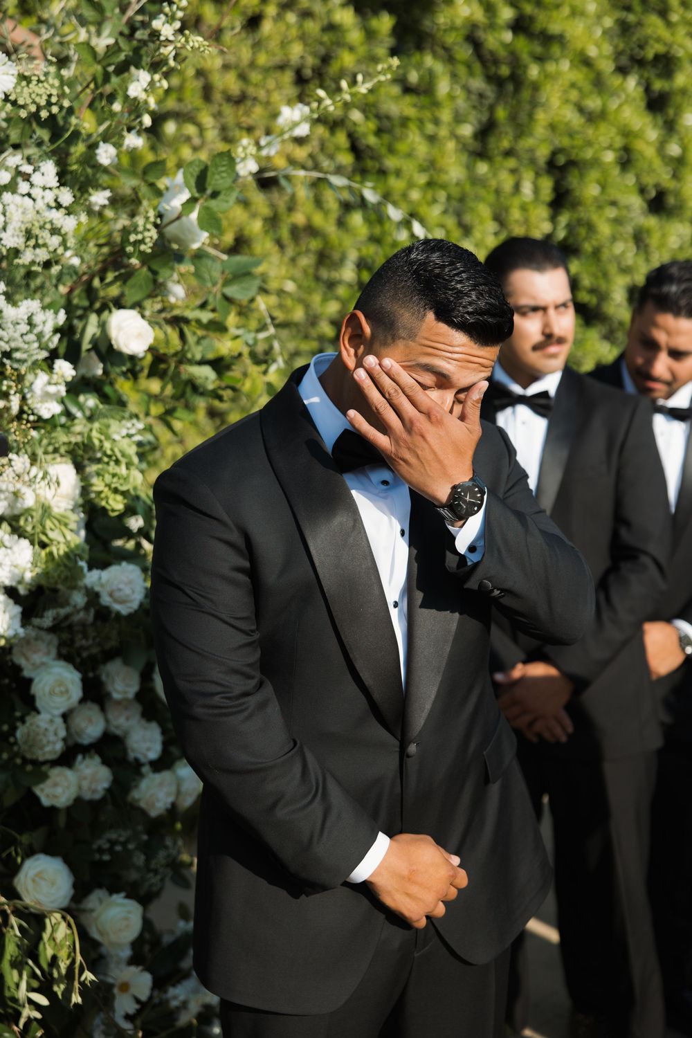 Groom emotional and crying as he watches his bride walk down the aisle at Tuscan Rose Ranch in Santa Paula, California
