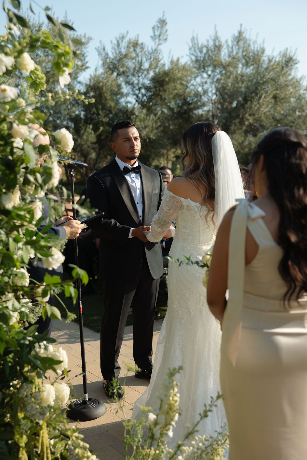 Groom reading vows during a wedding ceremony at Tuscan Rose Ranch in Santa Paula, California