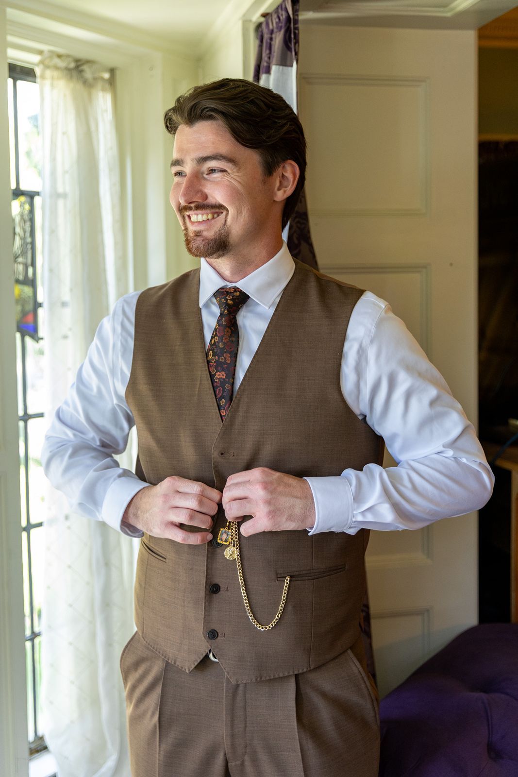Groom getting ready in the Thornewood Castle Wedding grooms suite