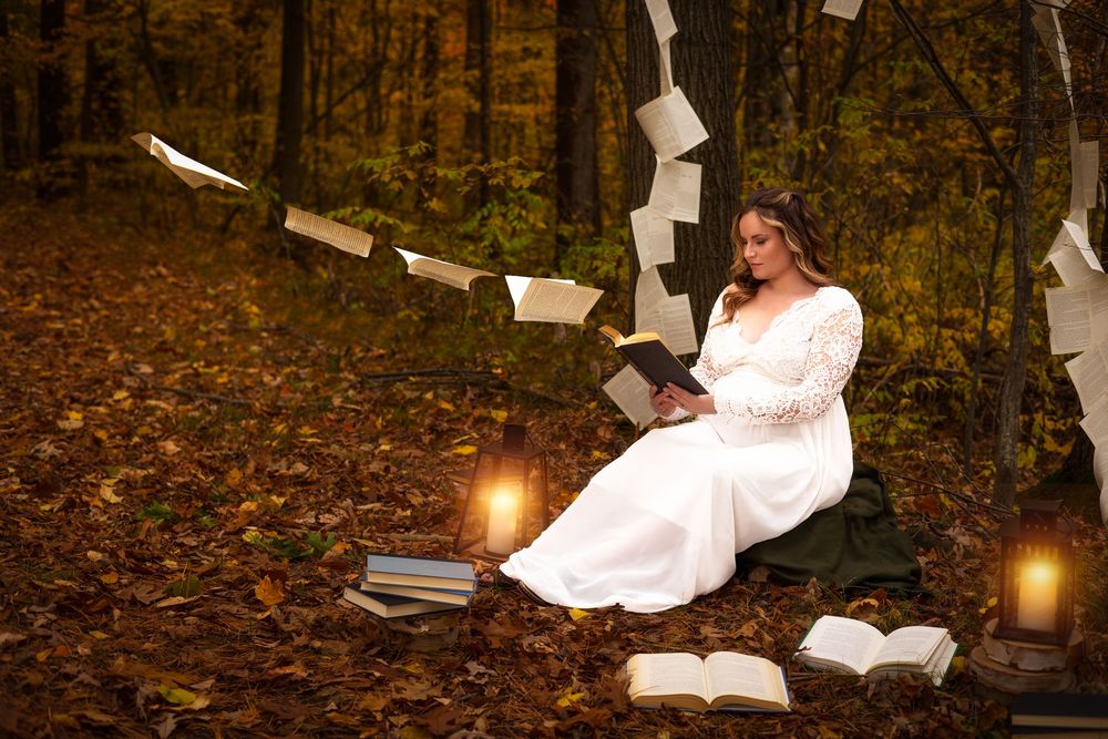Pages of books float magically through a mystical autumn forest scene illuminated by glowing lantern light.