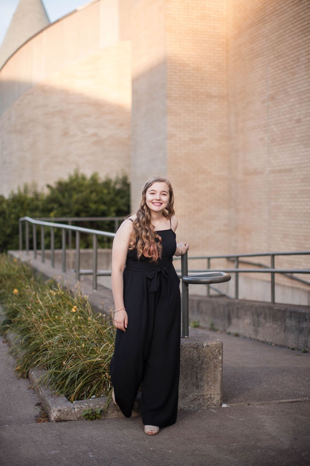 Downtown Duluth senior portraits with brick wall and alleyway textures