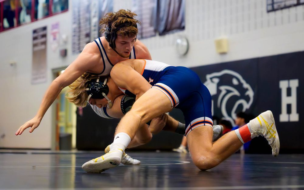 Christian Burd of Hershey Wrestling attempts a takedown on his opponent during the 100th win match.