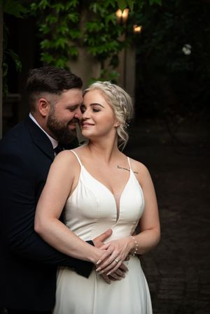 Bride and groom embracing during wedding portraits in Gauteng with natural, romantic style