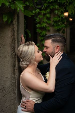 Bride and groom embracing at wedding venue in Gauteng with natural, romantic style