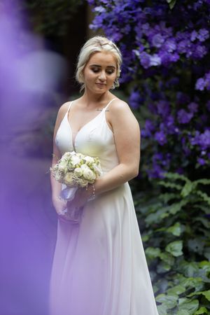 Bride holding bouquet during wedding portraits in Gauteng with natural, elegant style