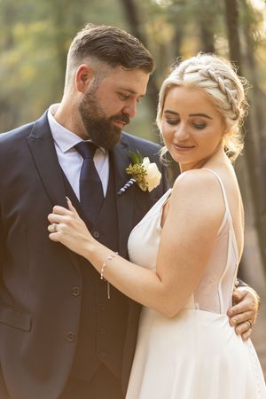 Bride and groom embracing during wedding portraits in Gauteng with soft, natural light