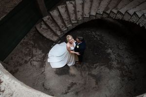 Bride and groom portrait on staircase during wedding in Gauteng with natural, elegant style
