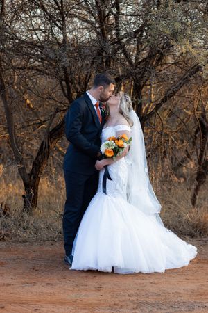 Bride and groom kissing during wedding portraits in Gauteng with natural, romantic style