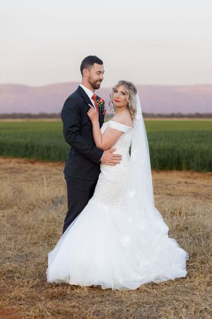 Bride and groom standing together during wedding portraits in Gauteng with natural, relaxed style