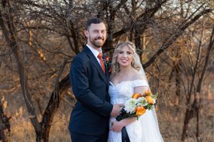 Bride and groom smiling together during wedding portraits in Gauteng with natural, relaxed style