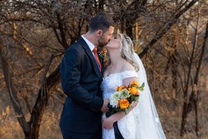 Bride and groom kissing during wedding portraits in Gauteng with natural, romantic style
