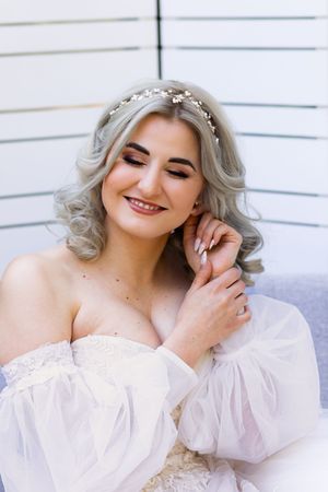Bride smiling during wedding preparation in Centurion with natural, elegant bridal styling