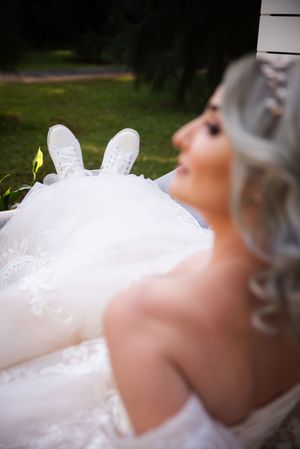 Bride relaxing in wedding dress during bridal portraits in Gauteng with natural, artistic style