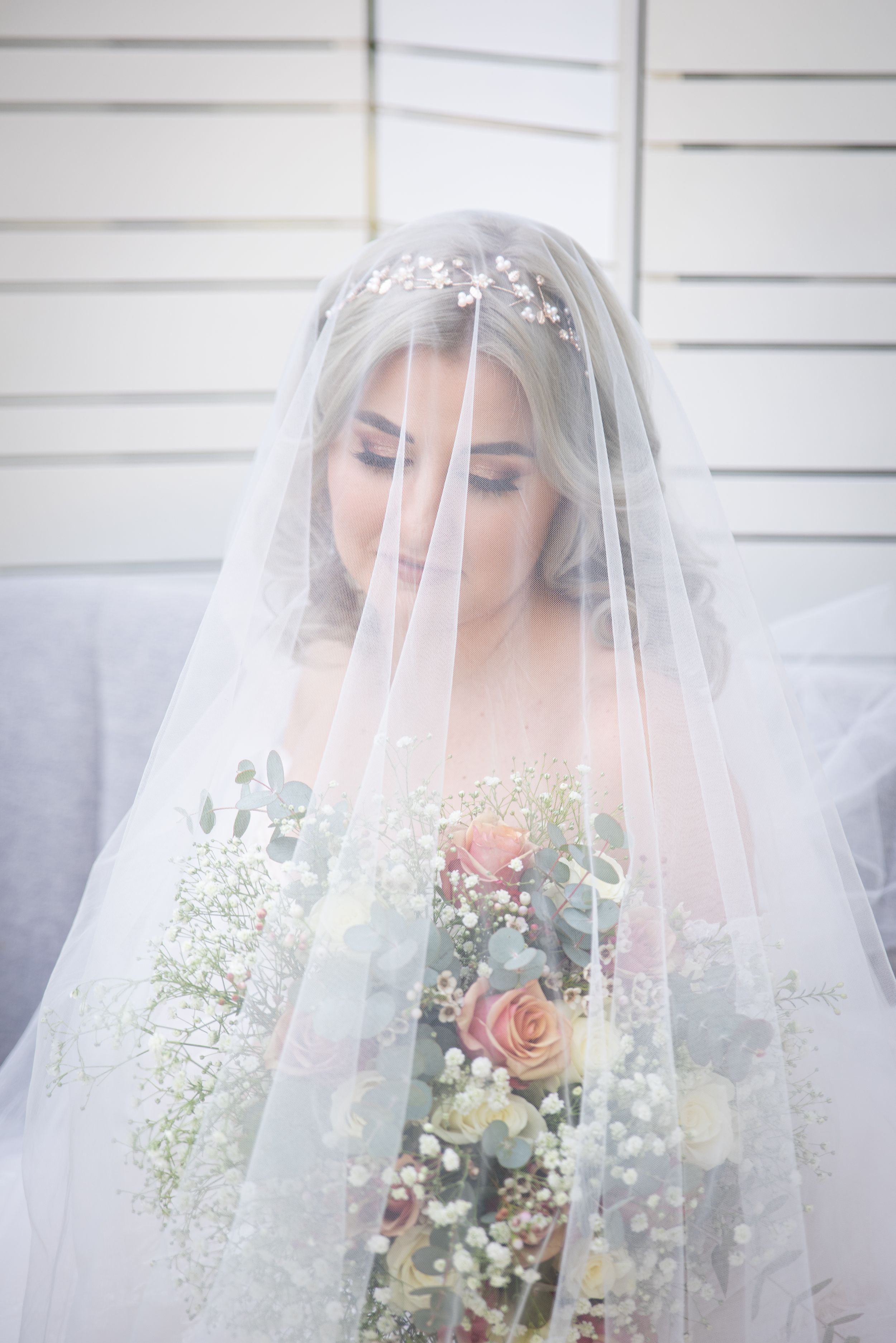 Bride portrait under veil during wedding preparation in Gauteng with soft, natural light