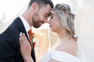 Bride and groom touching foreheads during wedding portraits in Gauteng with soft, natural light