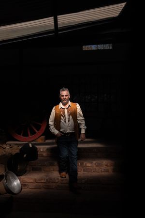 Groom portrait in dramatic light during wedding preparation in Gauteng