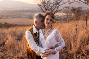 Bride and groom embracing during sunset wedding portraits in Gauteng with natural, relaxed style