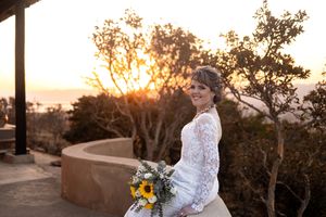 Bride holding bouquet at sunset during wedding in Gauteng with natural, relaxed style