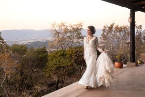 Bride walking at wedding venue overlooking landscape in Gauteng