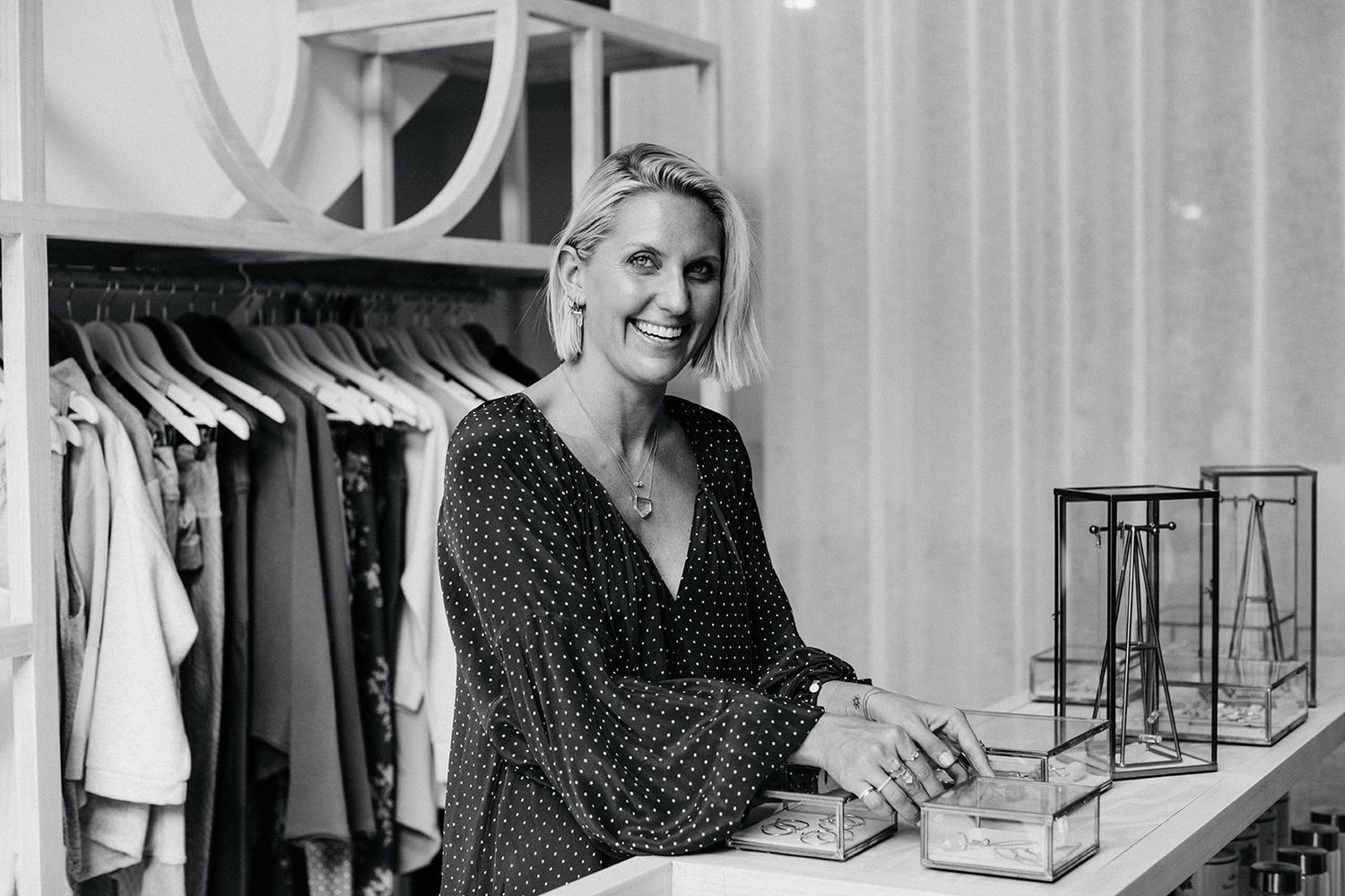 Three black and white photos show someone looking through clothing racks in what appears to be a retail store.