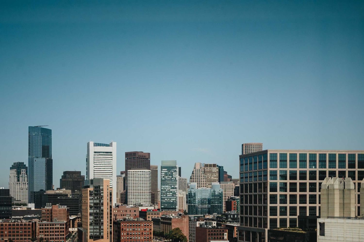 Boston skyline view from the Seaport District on the morning of a Boston wedding day