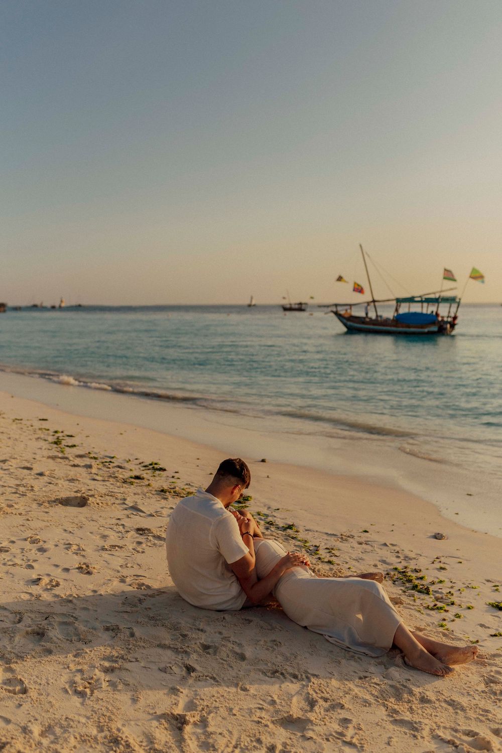 Couple enjoying golden hour light on Zanzibar coast