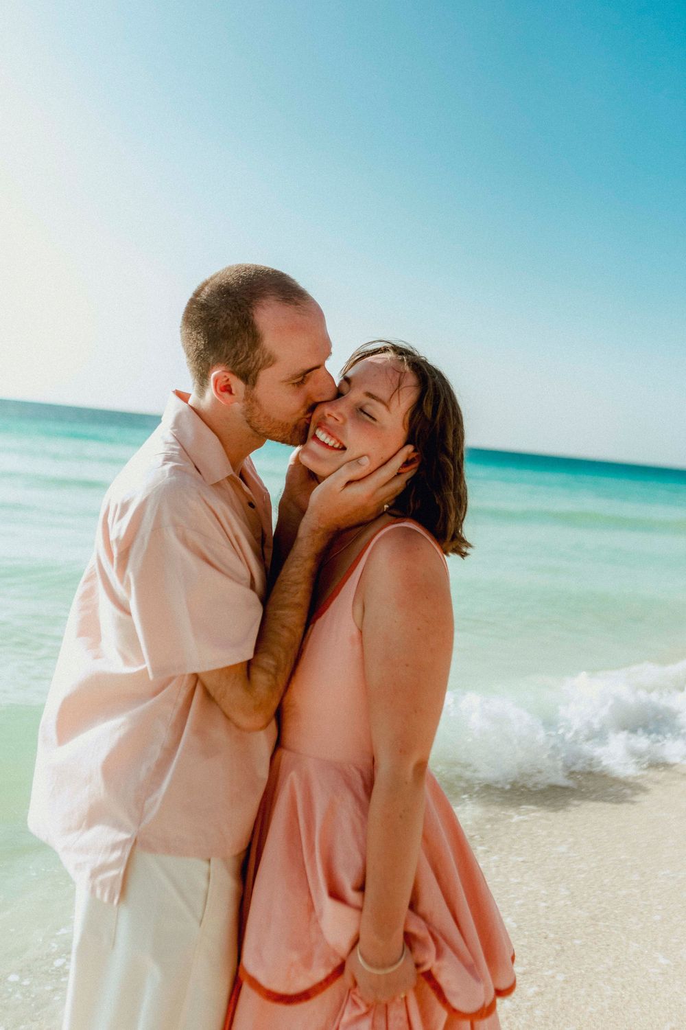 Bride and groom intimate moment by the Indian Ocean