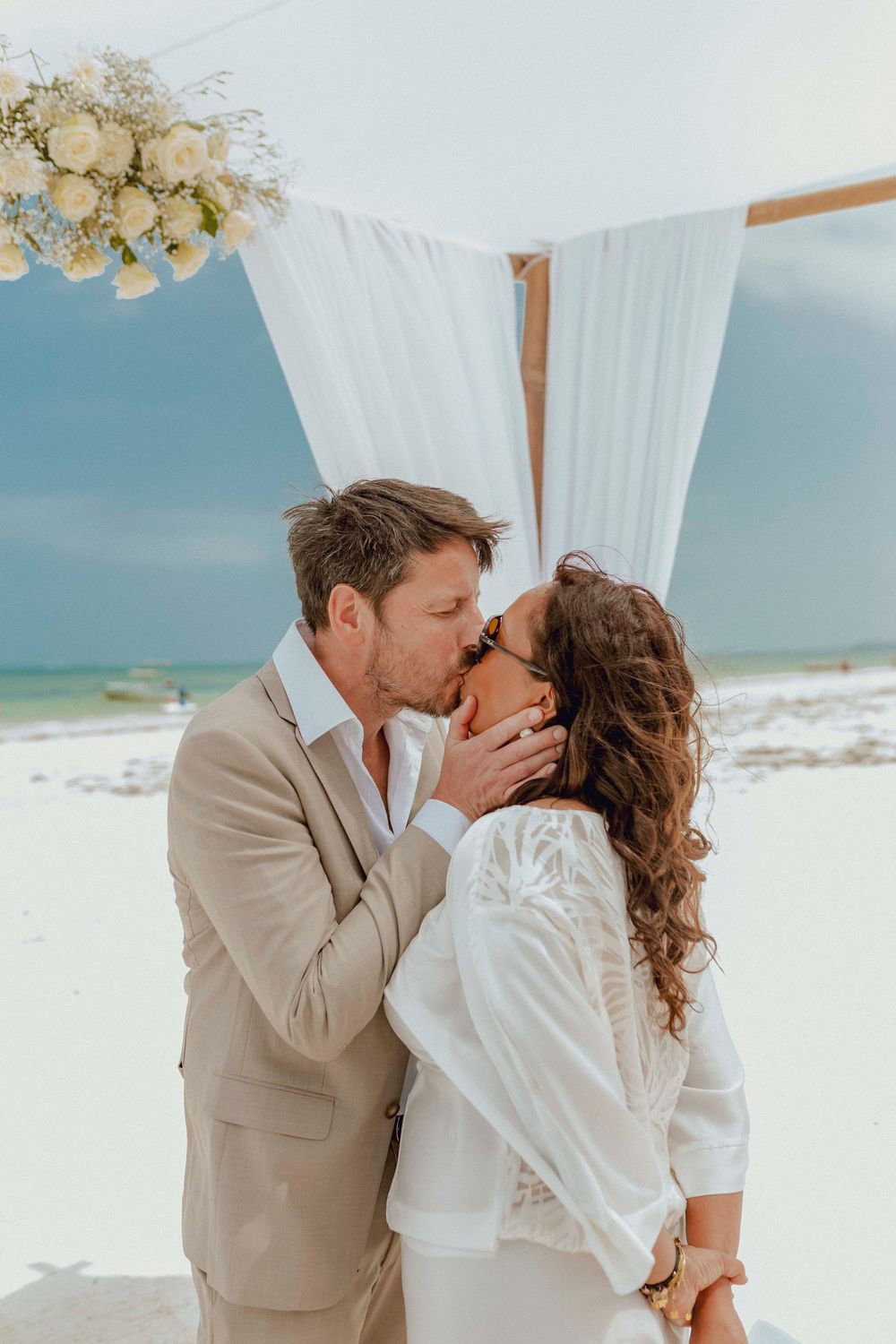 Couple laughing together during beach photoshoot