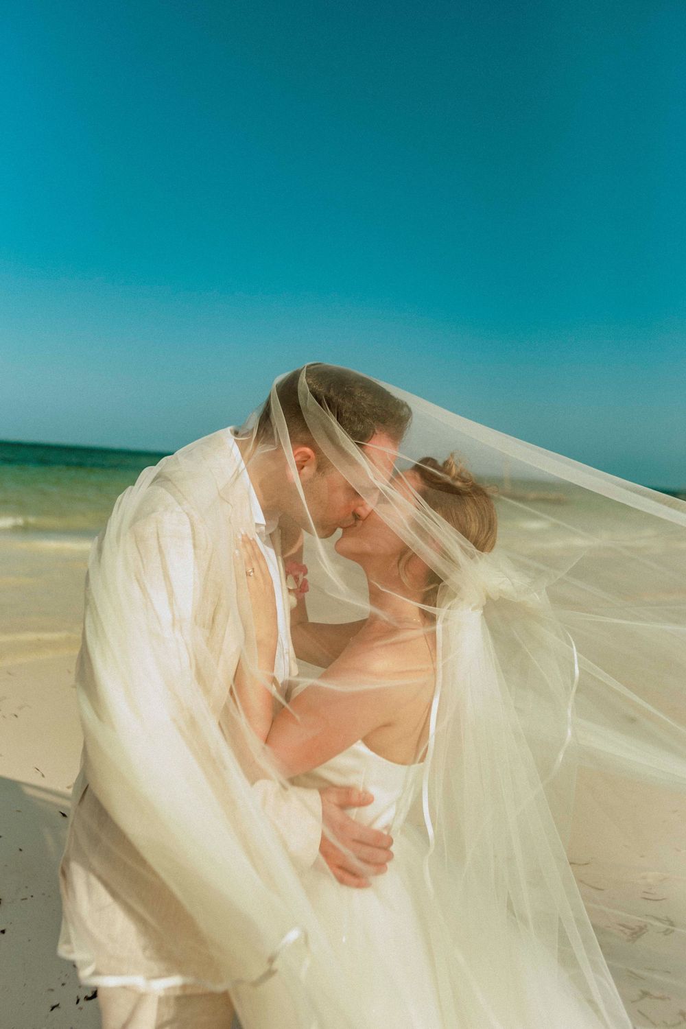 Zanzibar wedding couple under palm trees in Zanzibar