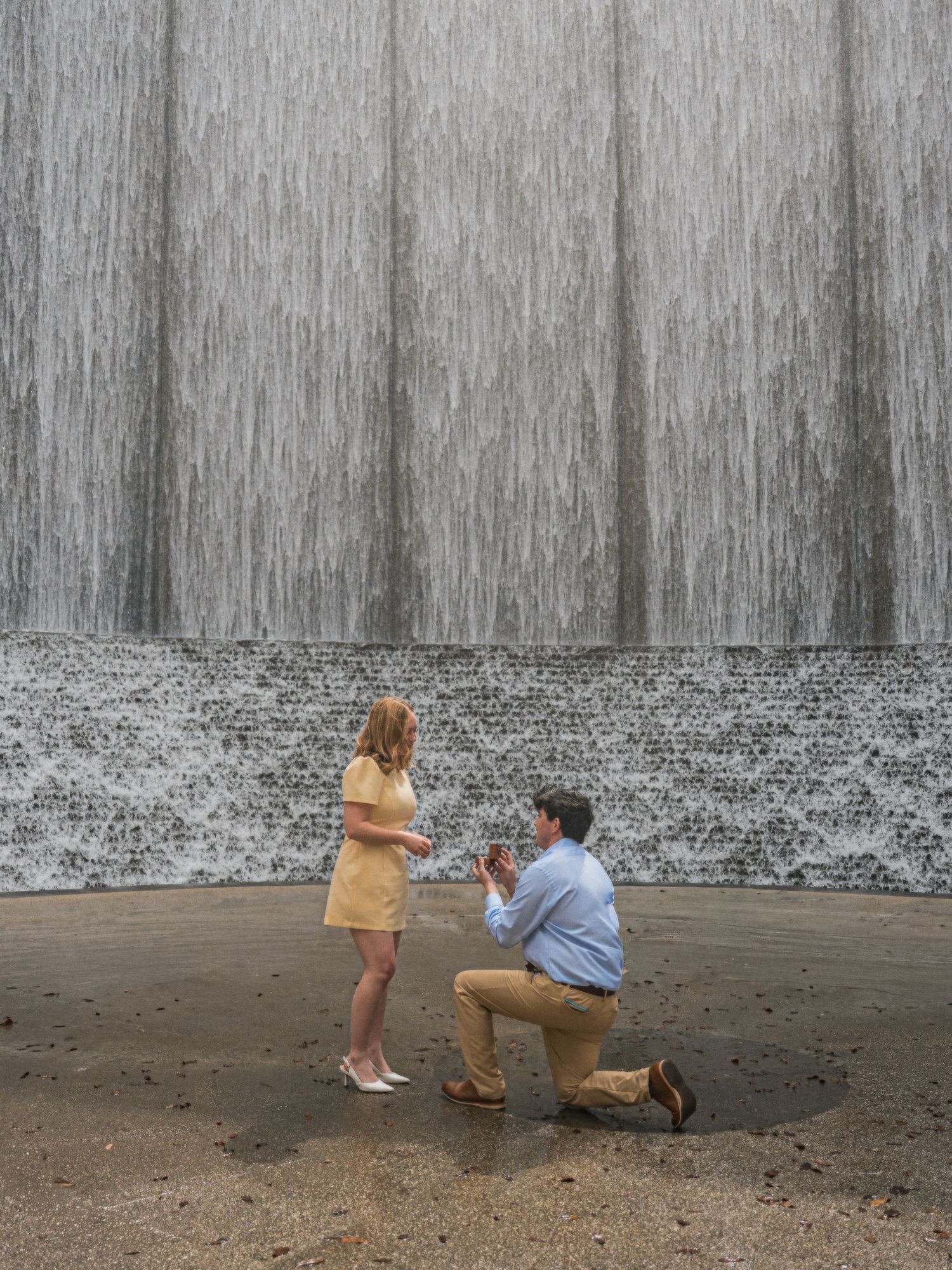 A sequence of photos showing a marriage proposal in front of a concrete wall.
