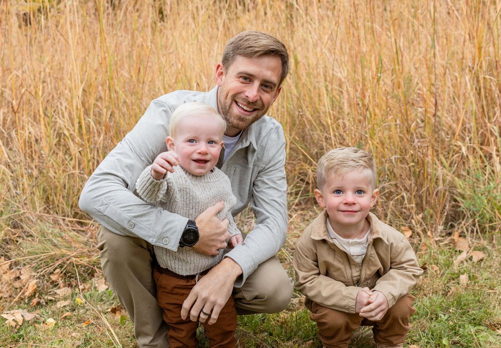 A series of candid outdoor family photos taken in a golden autumn field at sunset.